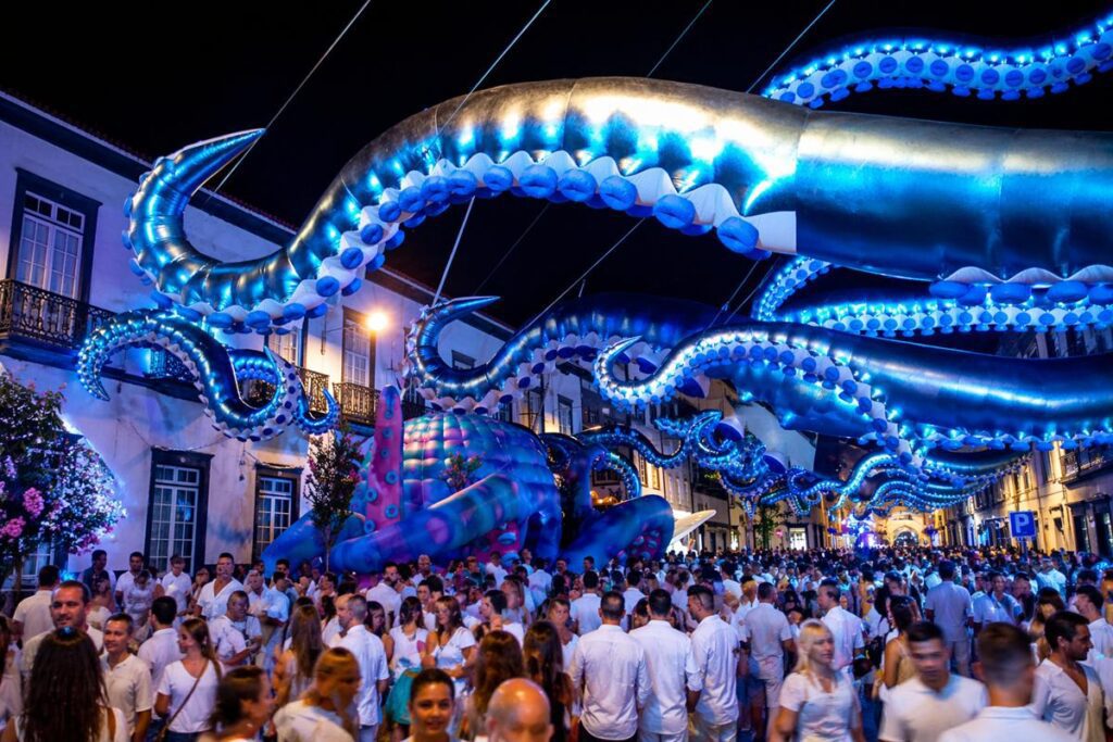 White Ocean festival in Ponta Delgada with giant illuminated octopus and crowd in São Miguel Azores