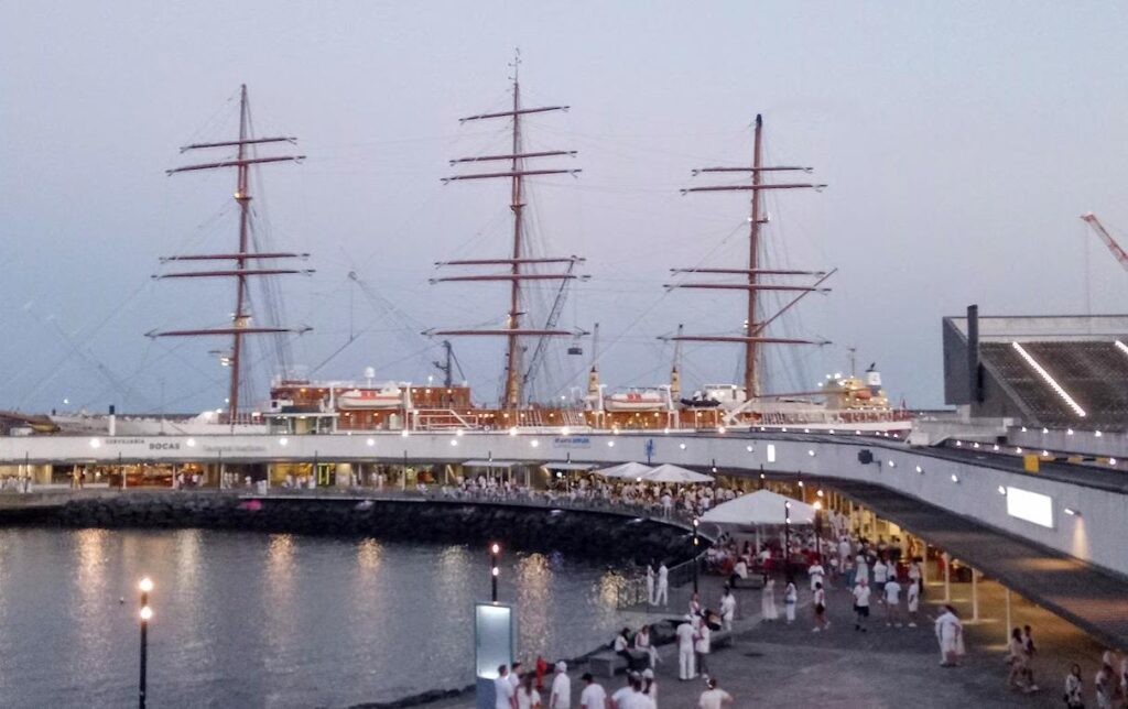 White Ocean festival atmosphere in Ponta Delgada harbor São Miguel Azores with people dressed in white