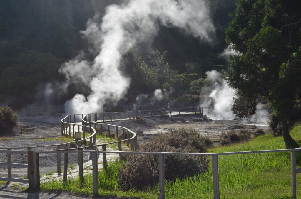Furnas fumaroles geothermal area with steam rising from the ground São Miguel Azores