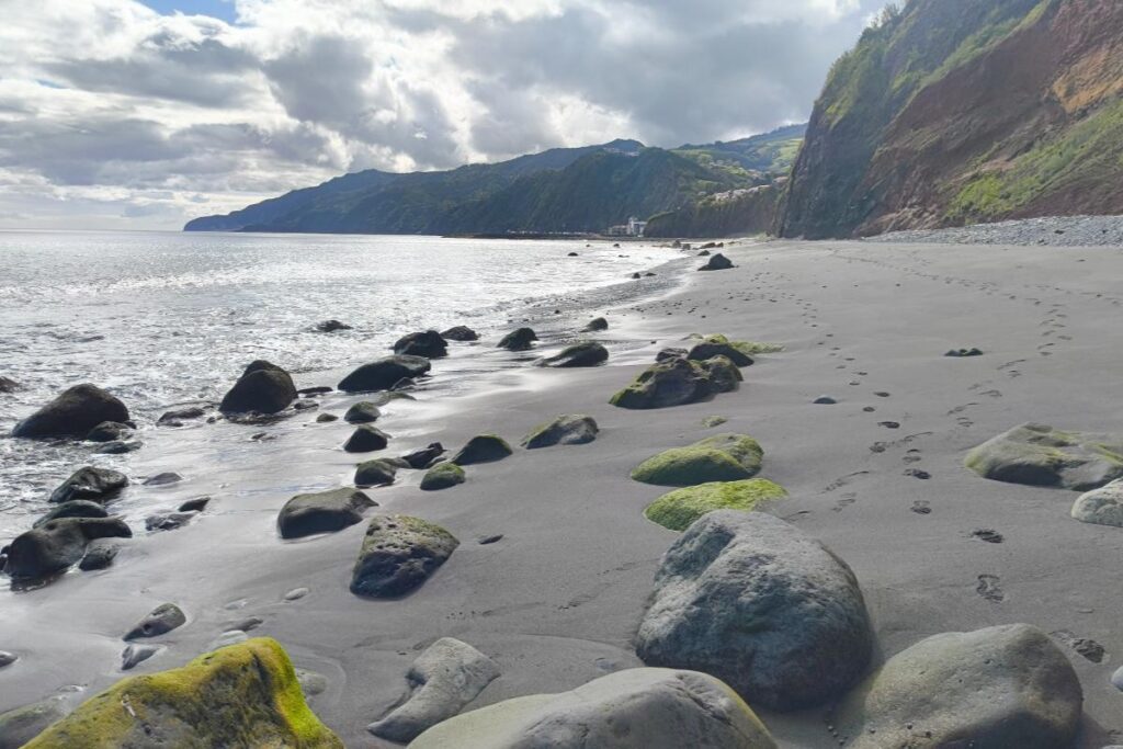 Wild volcanic black sand beach at Praia do Morro in Povoação São Miguel Azores