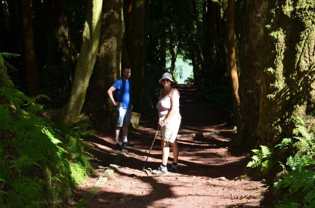 Visitors walking along a forest path in Parque Grena Furnas São Miguel Azores